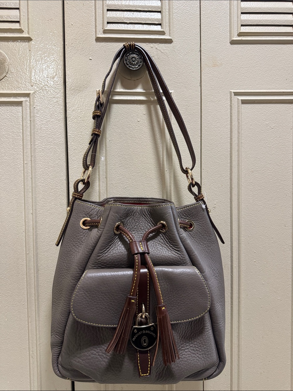 Dooney & Bourke Samba Drawstring Bag in gray.  (Retail $498) NWOT
